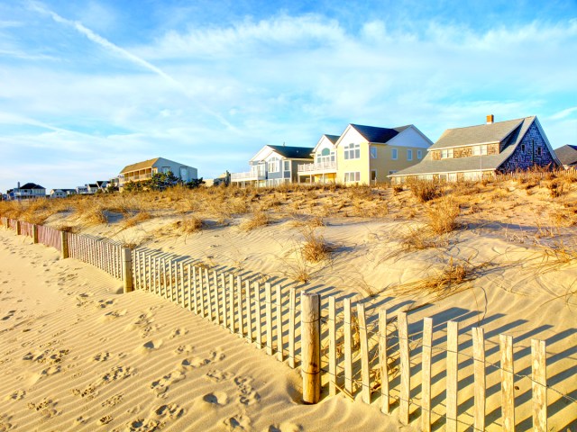 Homes alongside sandy beach in Delaware