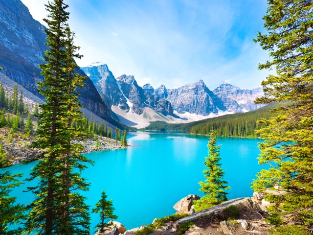 Turquoise waters of Moraine Lake surrounded by Canadian Rockies