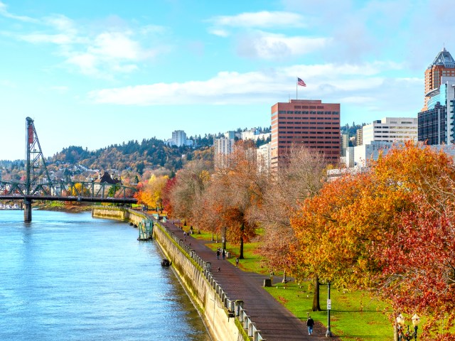 Riverfront trail lined with fall foliage in Portland, Oregon