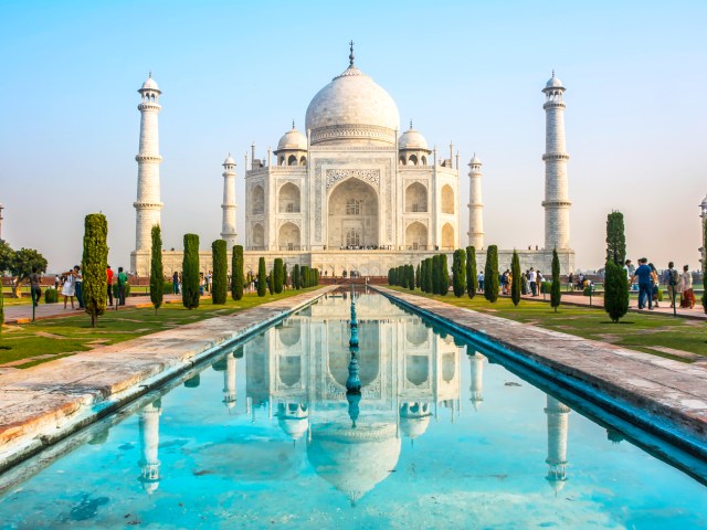 Reflective pool with view of Taj Mahal in Agra, India