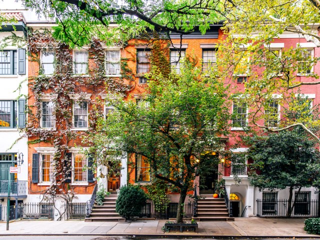 Brick apartment buildings on tree-lined street in the West Village, New York City