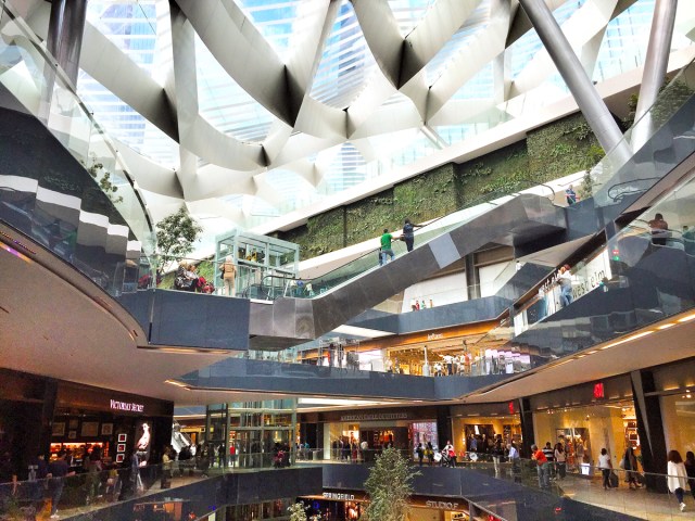 Shops and escalators under glass roof in Toreo Parque Central in Mexico City