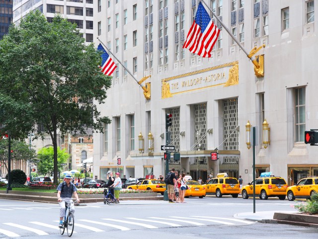 Yellow New York City taxi cabs in front of the Waldorf Astoria Hotel in midtown Manhattan