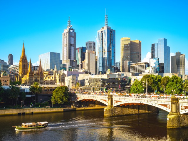 Boat on river through Melbourne Business District