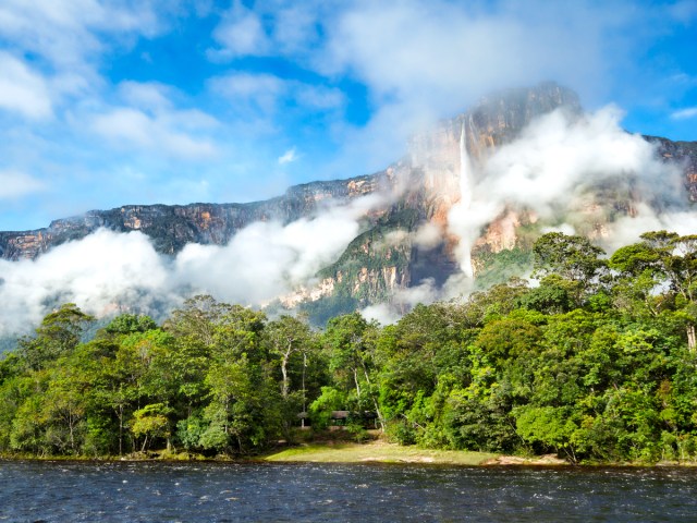 Distant view through jungle of Angels Falls, world's tallest waterfall, in Venezuela 