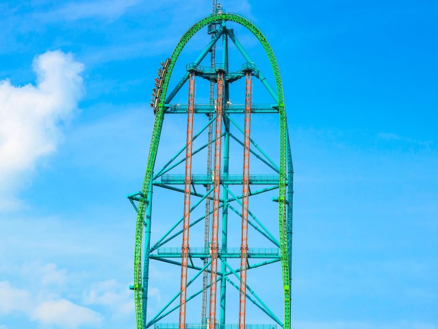 Bright green track of Kingda Ka roller coaster against blue sky of Jackson Township, New Jersey
