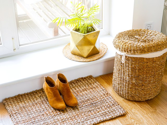 Pair of shoes by front door in house