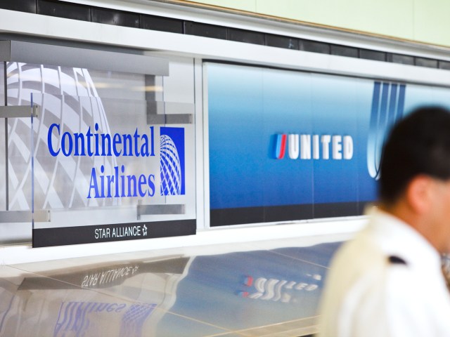 Continental and United Airlines  signage at airport check-in counter