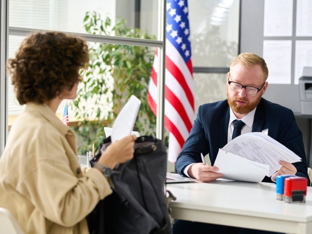 Person applying for visa with visa officer