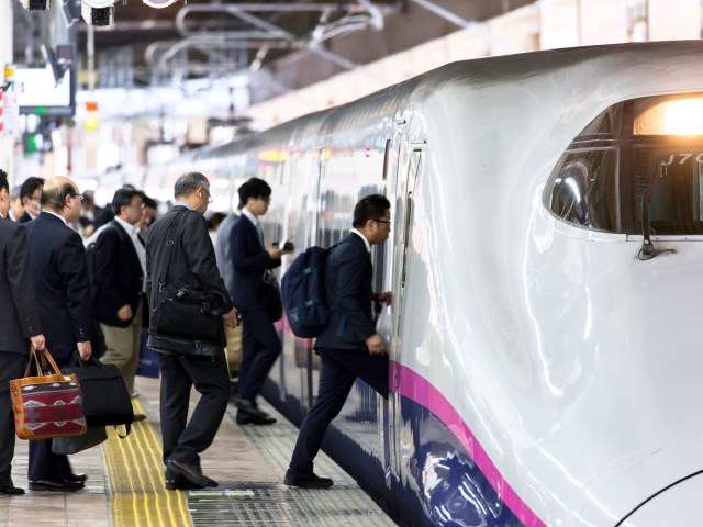 Passengers boarding bullet train in Japan