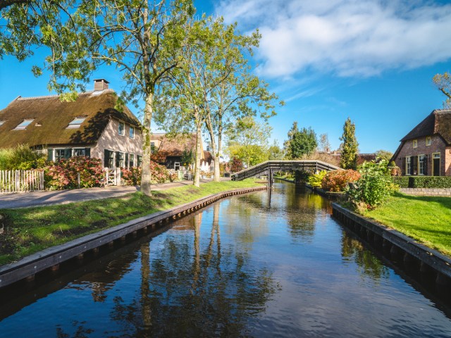 Canal lined by homes in Giethoorn, the Netherlands