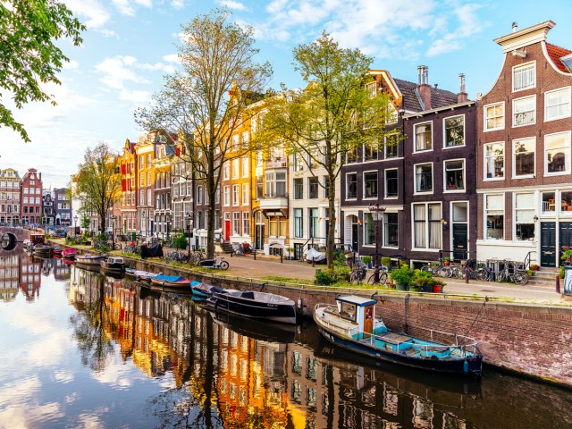 Street and homes along canal in Amsterdam, Netherlands