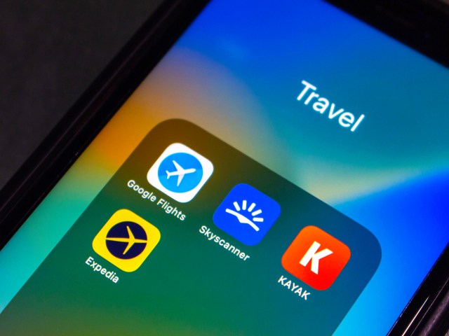 Close-up of smartphone travel app folder