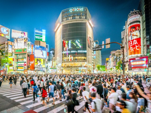 Crowded scramble crossing at night in Tokyo, Japan