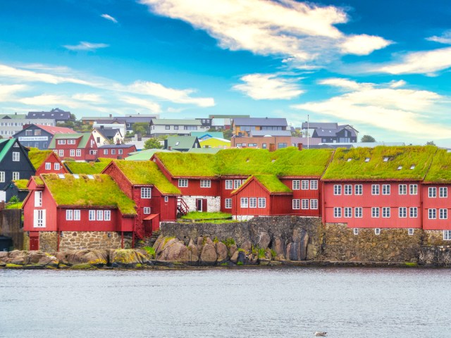 Grass-roofed buildings along the water in Tórshavn, Faroe Islands