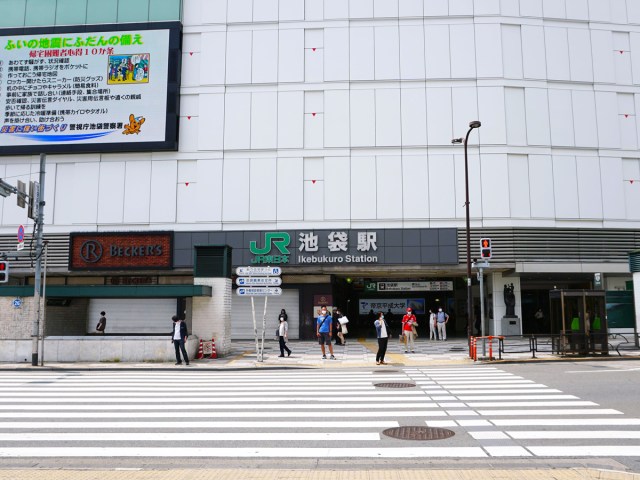 Crosswalk leading to entrance of Ikebukuro Station in Tokyo, Japan