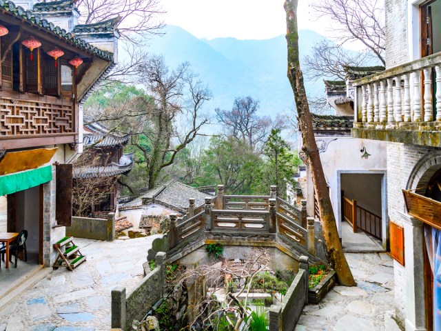 Historic architecture overlooking mountains in Yanshi, China
