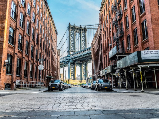 Cobblestone street in Brooklyn, New York, with view of Manhattan Bridge