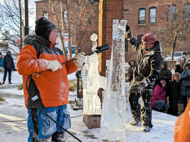 Ice sculptor working on creation at the Fire & Ice Festival in Canandaigua, New York