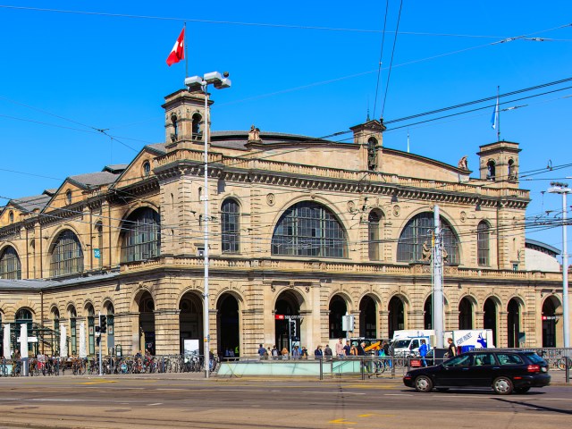 Swiss flag flying over Zurich Hauptbahnhof station