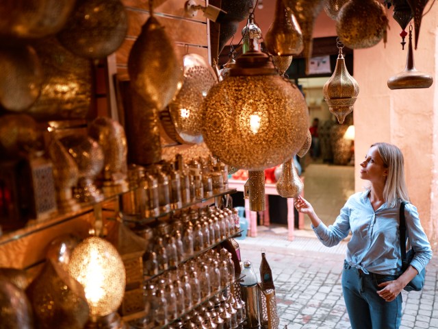 Woman browsing souvenirs at street market