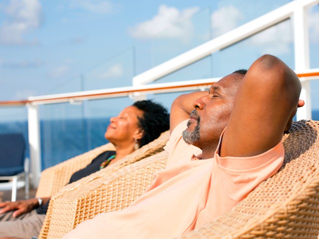 Couple relaxing in the sun on cruise ship