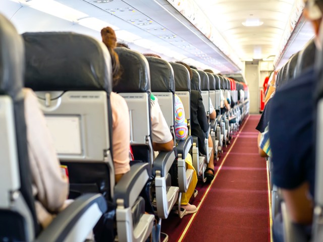 View of aircraft cabin from back to front