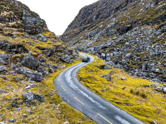 Car on narrow, winding mountain road