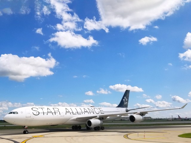 Airbus A340-300 painted in Star Alliance livery taxiing at airport