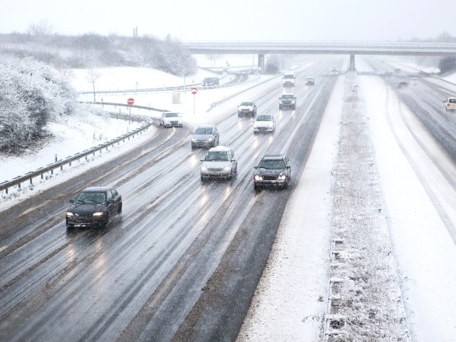 Cars on snowy highway