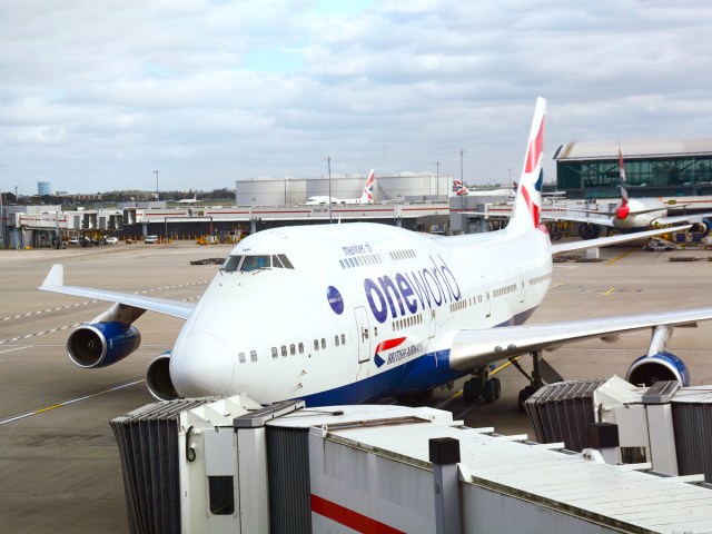 British Airways Boeing 747 painted in SkyTeam livery pulling into gate