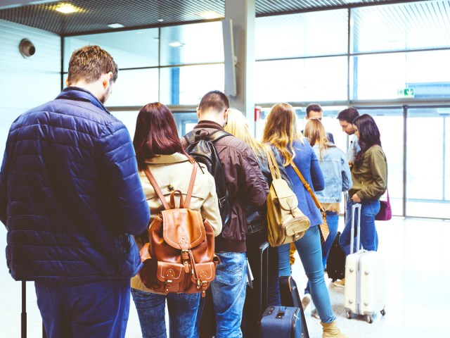 Passengers lining up to board aircraft