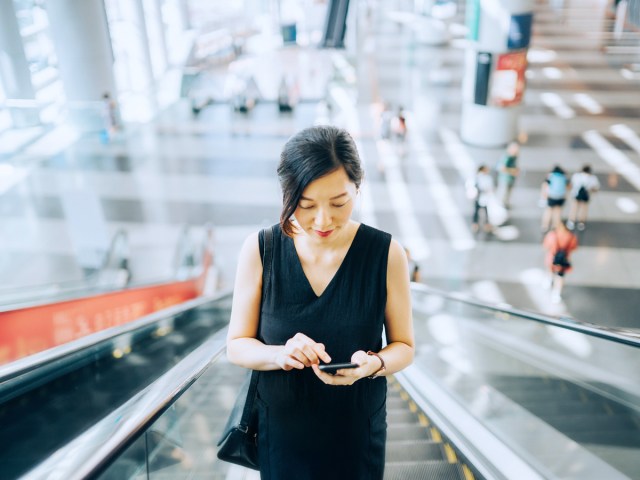 Passenger on escalator at airport