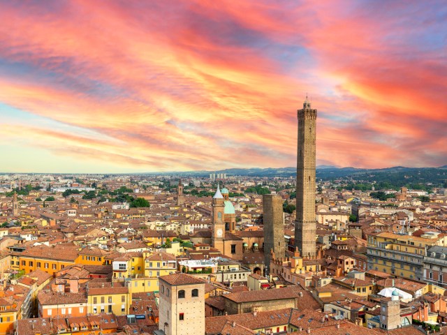 Torre Asinelli and Torre Garisenda above the skyline of Bologna, Italy, at sunset