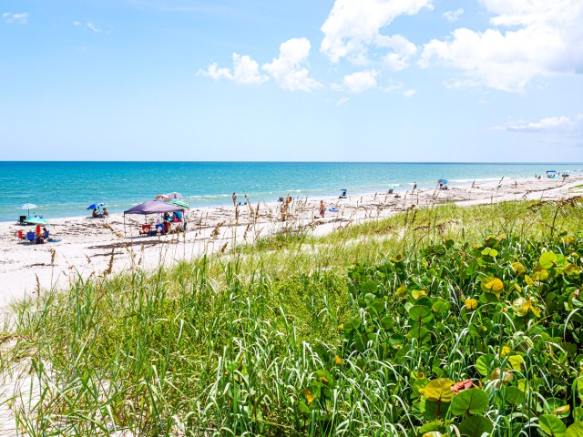 Beachgoers relaxing on Melbourne Beach, Florida