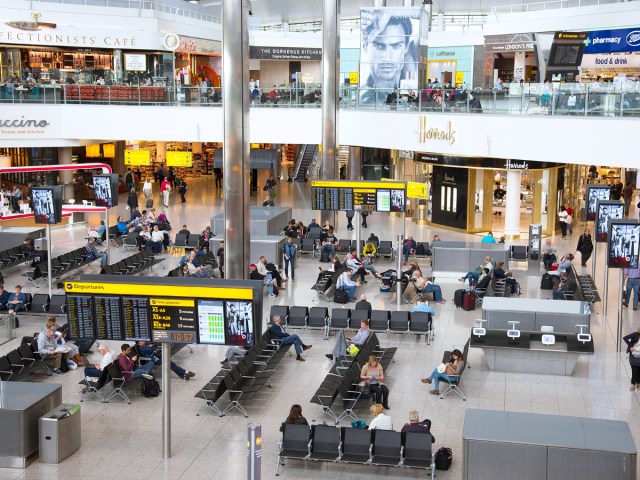 Passenger waiting area and shops inside London Heathrow Airport