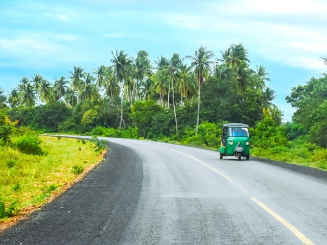 Tuk tuk vehicle on road in Kenya