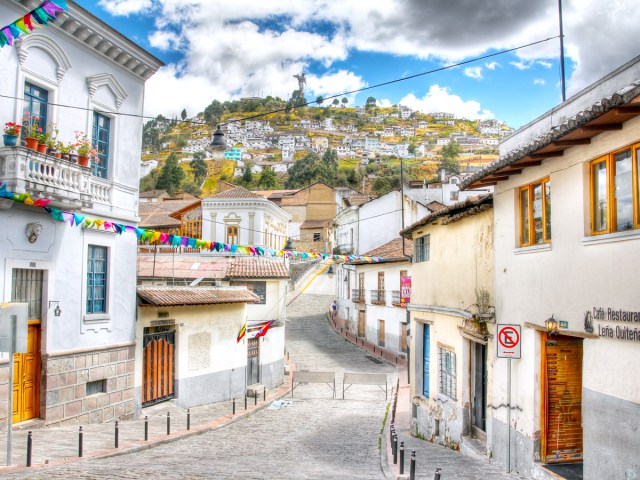 Narrow winding street through hills of Quito, Ecuador