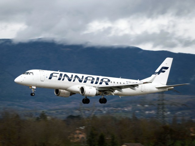 Finnair aircraft on approach for landing on cloudy day