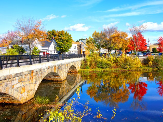 Bridge over river in Rochester, New Hampshire, in autumn