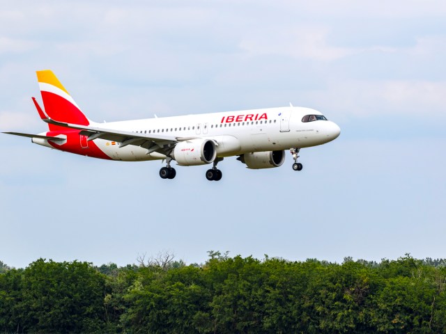 Iberia aircraft landing over tree tops