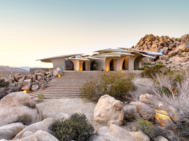 High Desert House surrounded by rocky landscape of Joshua Tree, California