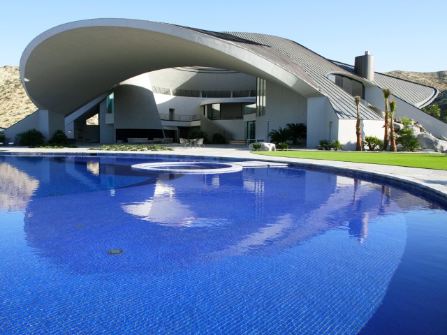 Curved roof design and swimming pool of the Bob Hope House in Palm Springs, California