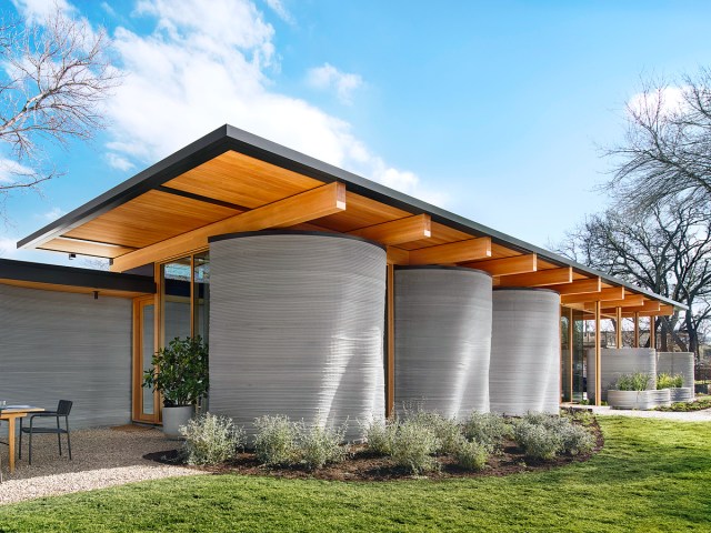 Exterior of House Zero in Austin, Texas, under blue skies