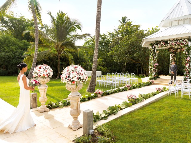 Bride walking down the aisle at Hilton La Romana, an All-Inclusive Adult Only Resort