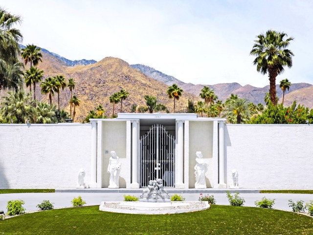 Statues framing entrance gate to the Liberace House in Palm Springs, California