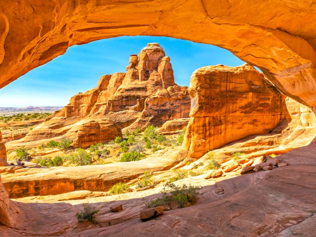View under sandstone arch in Arches National Park, Utah