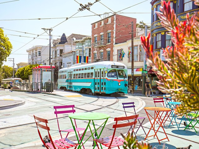 Cable car beside sidewalk cafe in San Francisco, California