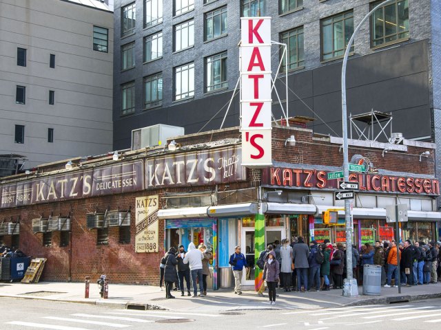 Diners lining up outside Kat'z Delicatessen in New York City