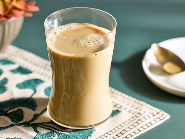 Glass of coffee milk on placemat
